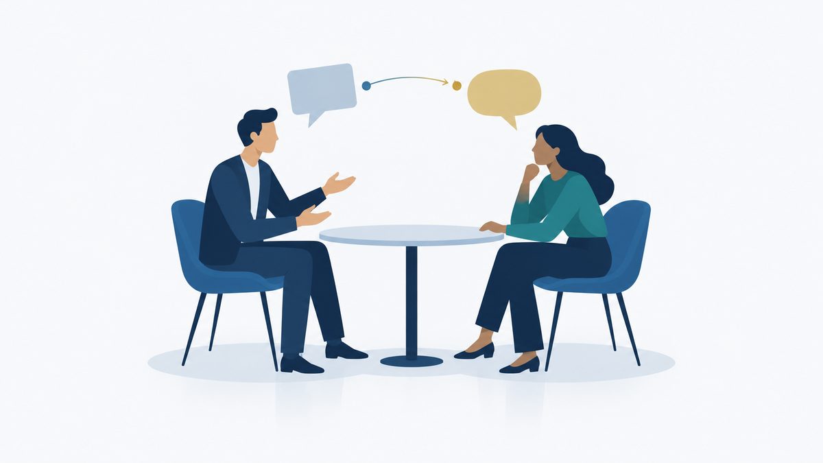 Illustration of two colleagues having a feedback conversation at a table